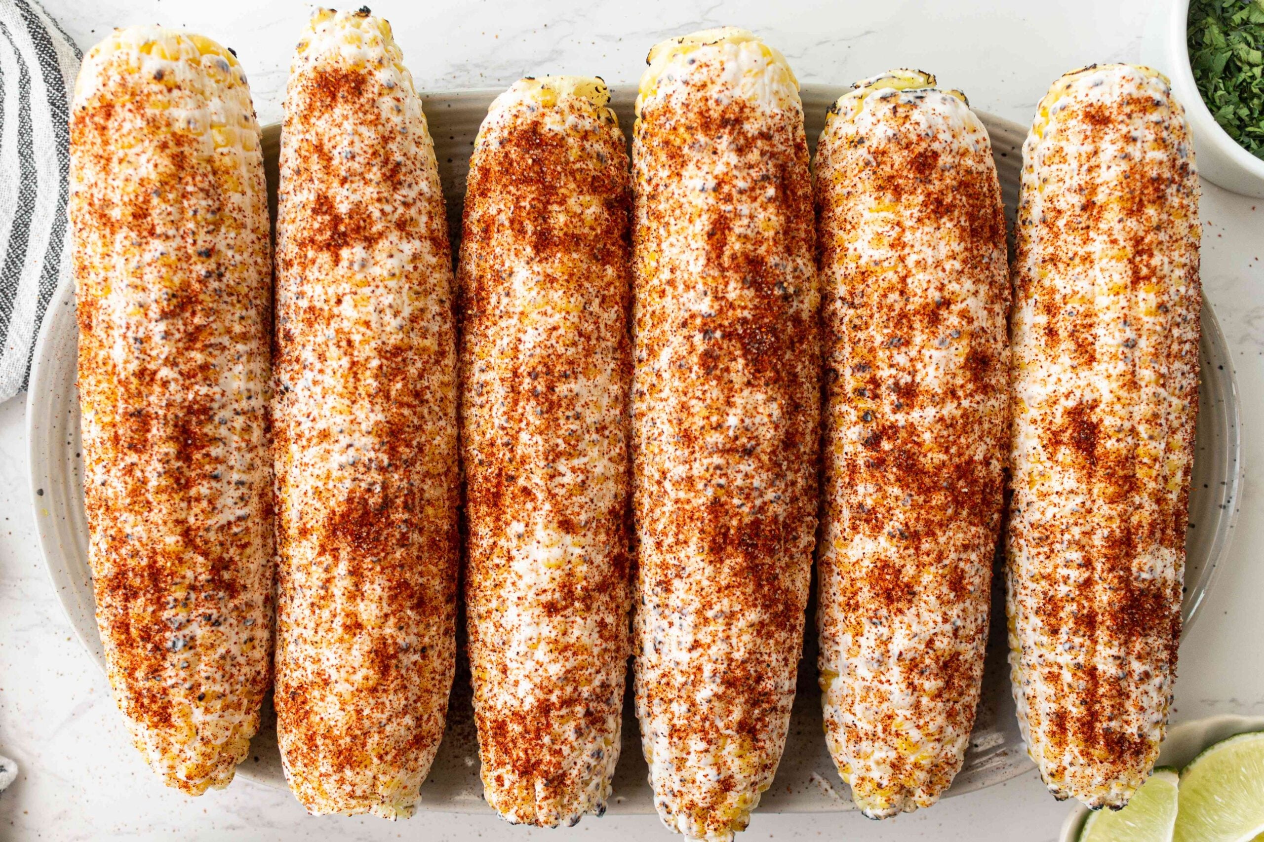 Mexican grilled corn coated in chili powder, black pepper and salt.