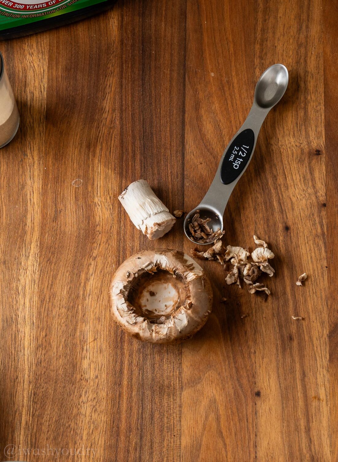 cleaning out mushroom cap with stem pieces. 