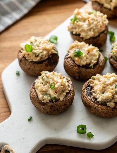 mushrooms stuffed with crab and cream cheese, topped with green onions.