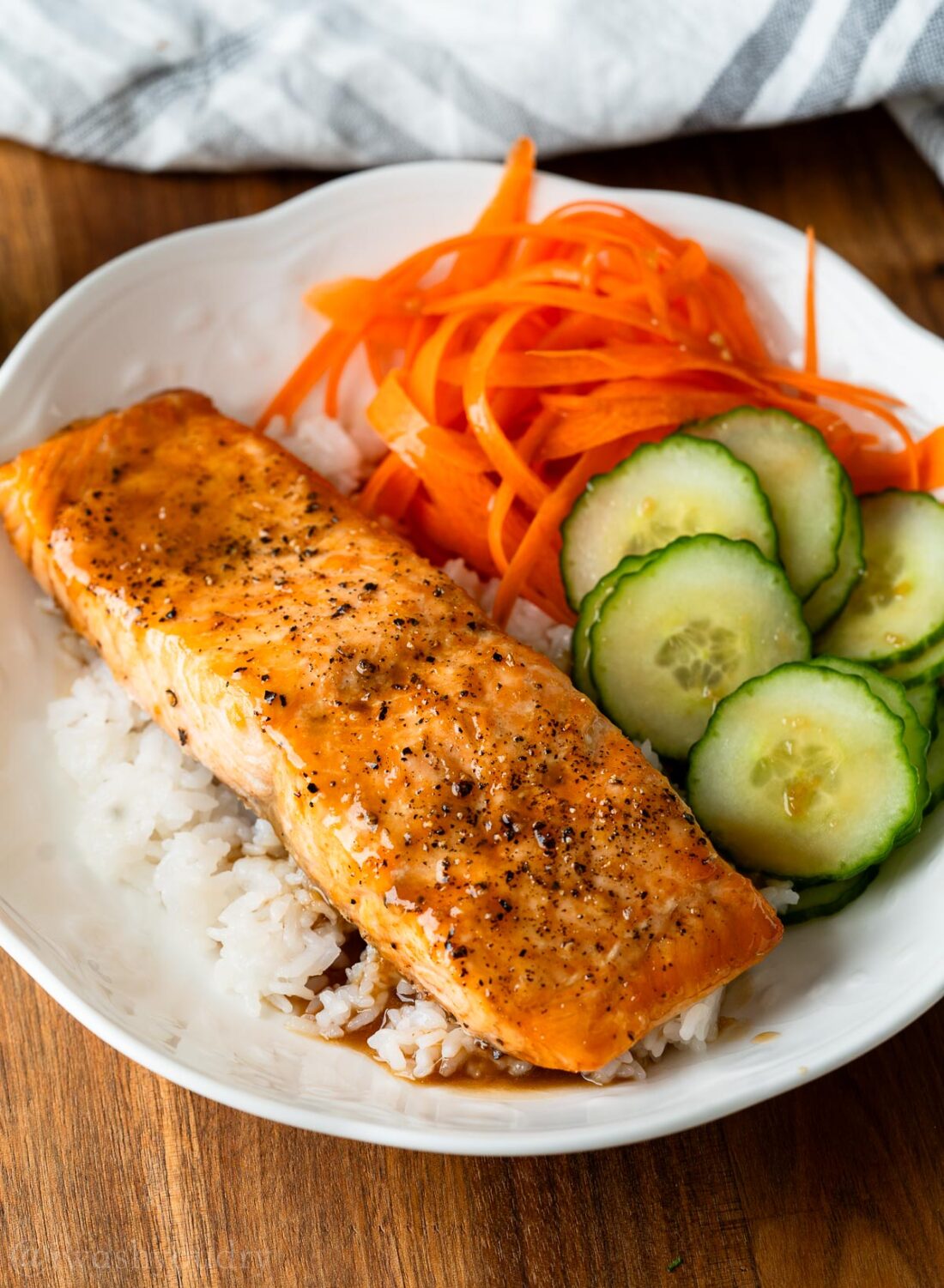 salmon bowl with dressing over rice.