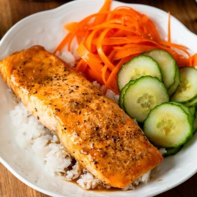 salmon bowl with dressing over rice.