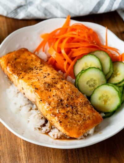 salmon bowl with dressing over rice.