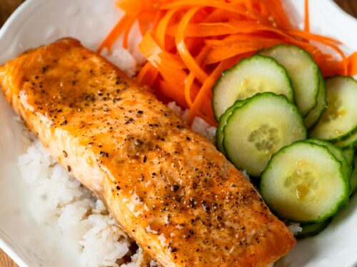 salmon bowl with dressing over rice.