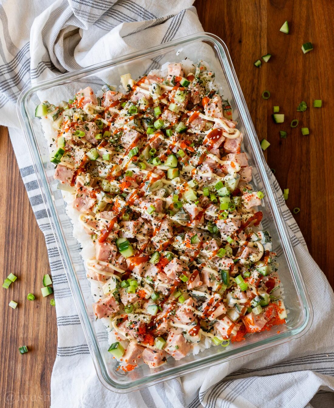 glass casserole dish with raw tuna poke in creamy and spicy mayo sauce.