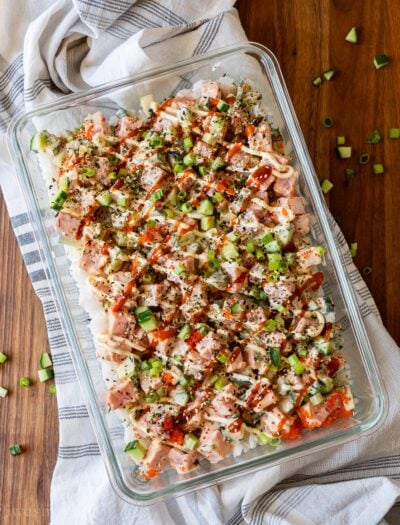 glass casserole dish with raw tuna poke in creamy and spicy mayo sauce.