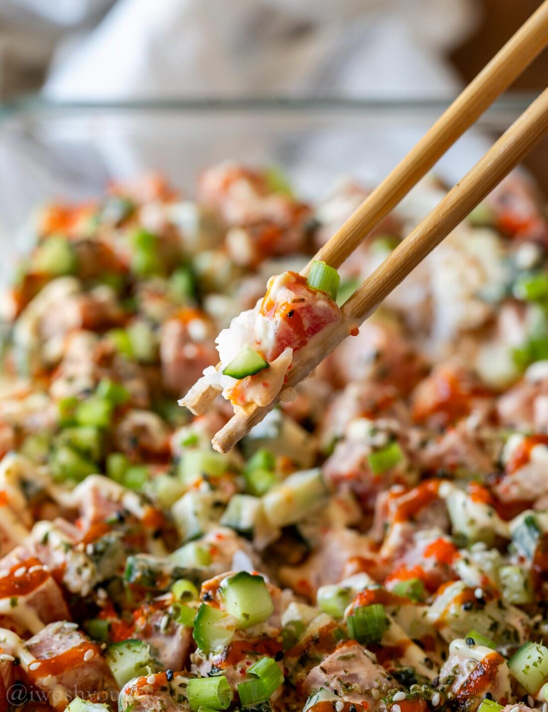 bite size ahi tuna poke on chopsticks.