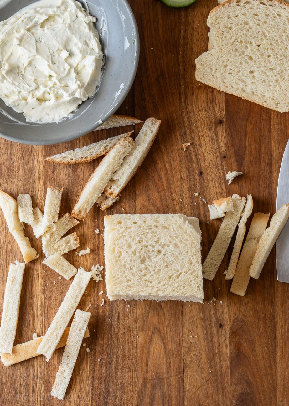 removing crust from sandwich bread.