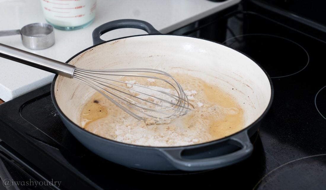 creating roux in pan with whisk.
