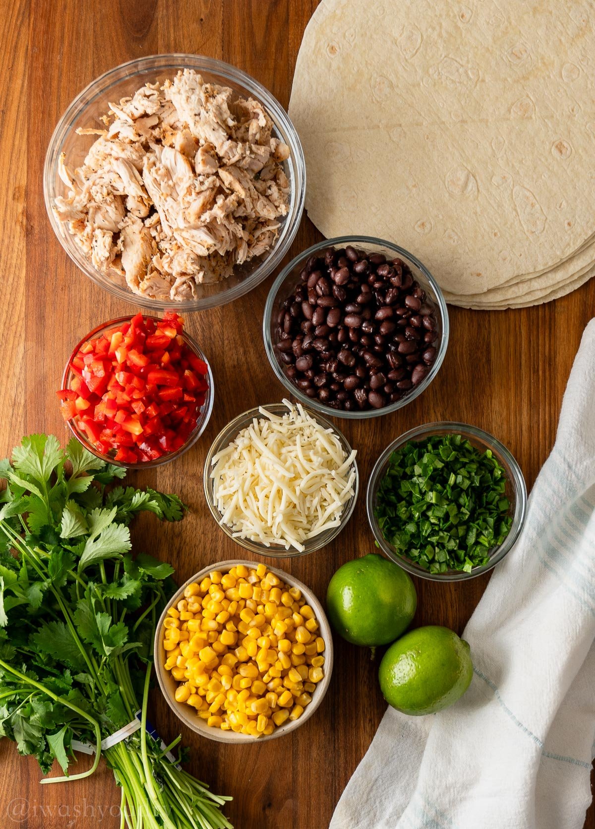 ingredients for crispy southern egg rolls on wooden surface.