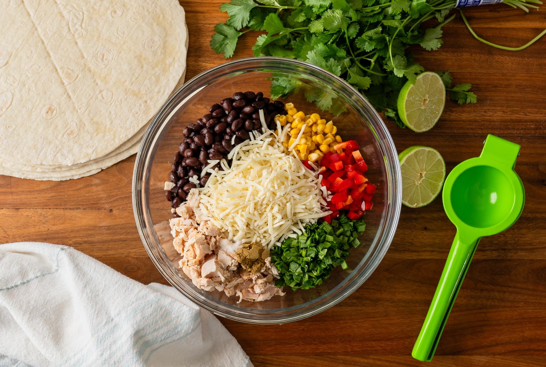 ingredients in bowl with lime squeezer next to it.