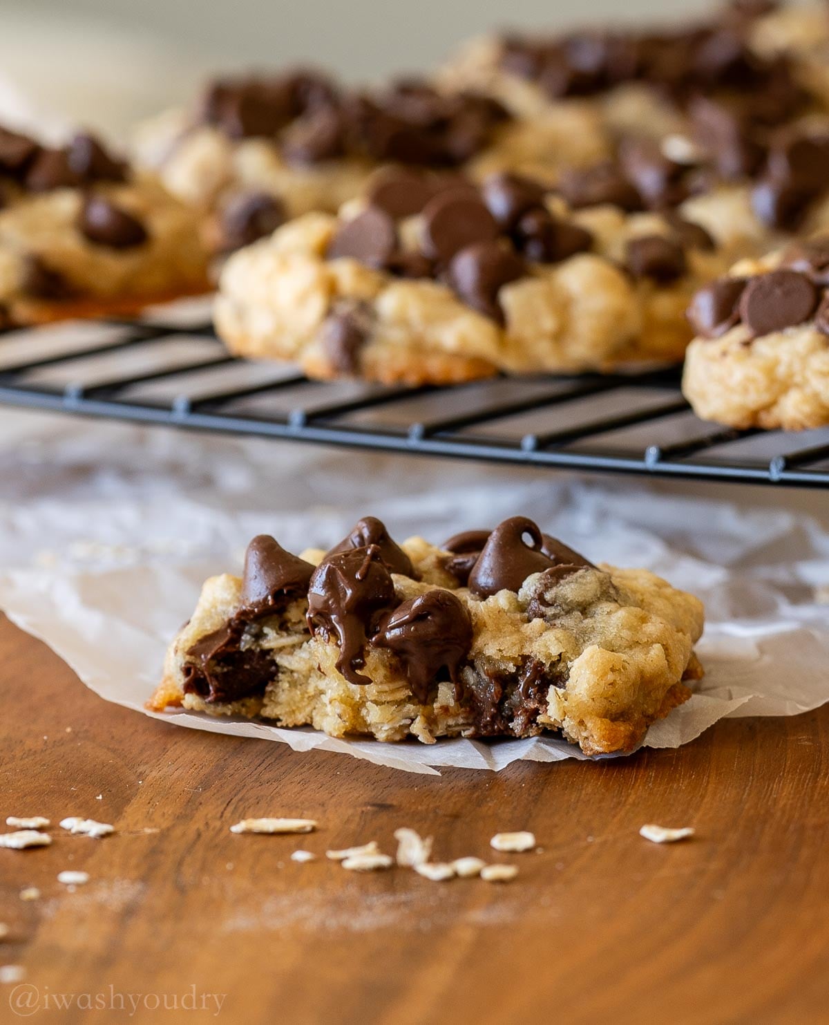 oatmeal chocolate chip cookie with bite taken out of it.