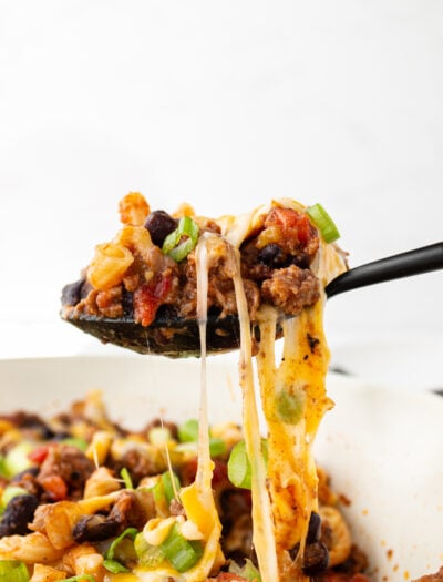 chili pasta skillet cheese pull close up