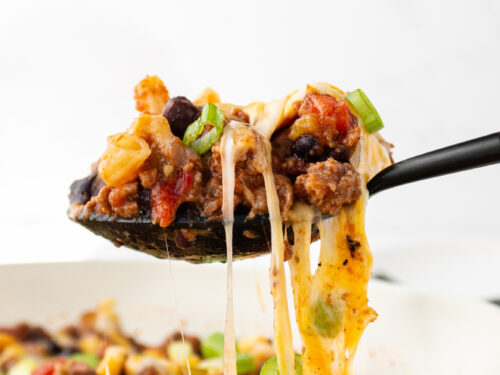 chili pasta skillet cheese pull close up