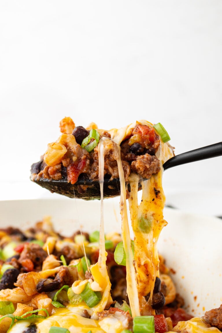 chili pasta skillet cheese pull close up